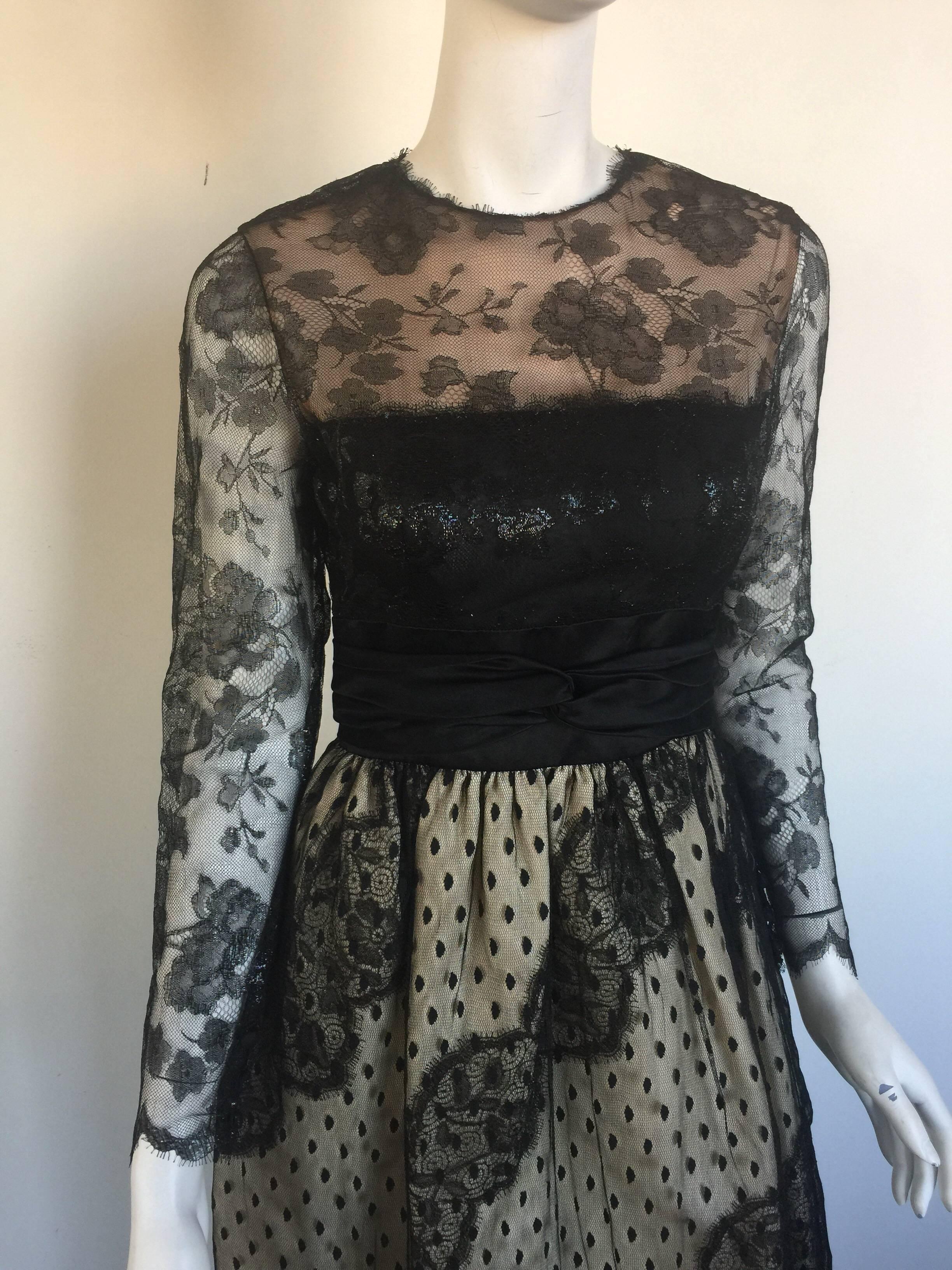 This stunning Bill Blass gown has a nude underlay with place lace and a metallic thread.  It is a classic piece and from the 1970s.  It has a double back zipper and a waist band.  It fits a small and is missing a size label so please check