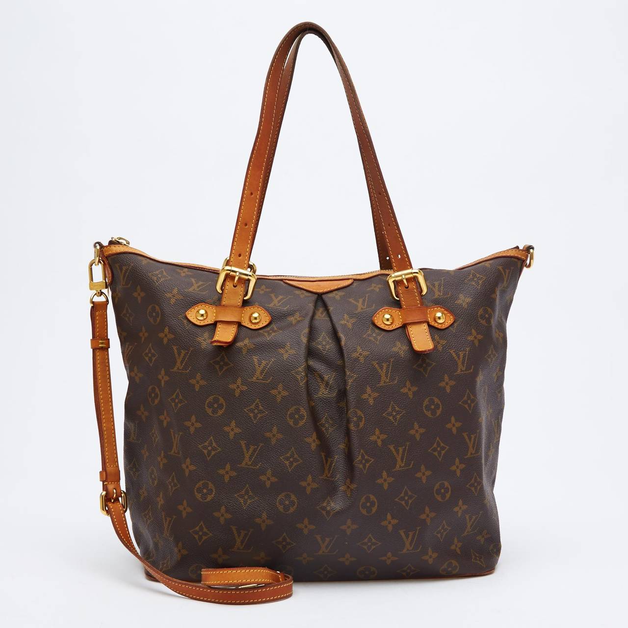 This authentic Louis Vuitton Palermo GM is beautifully crafted with Monogram canvas and leather trimming. It is accented with gold-tone hardware, and is constructed in a modern shape, making it quite spacious. It can be worn with or without its