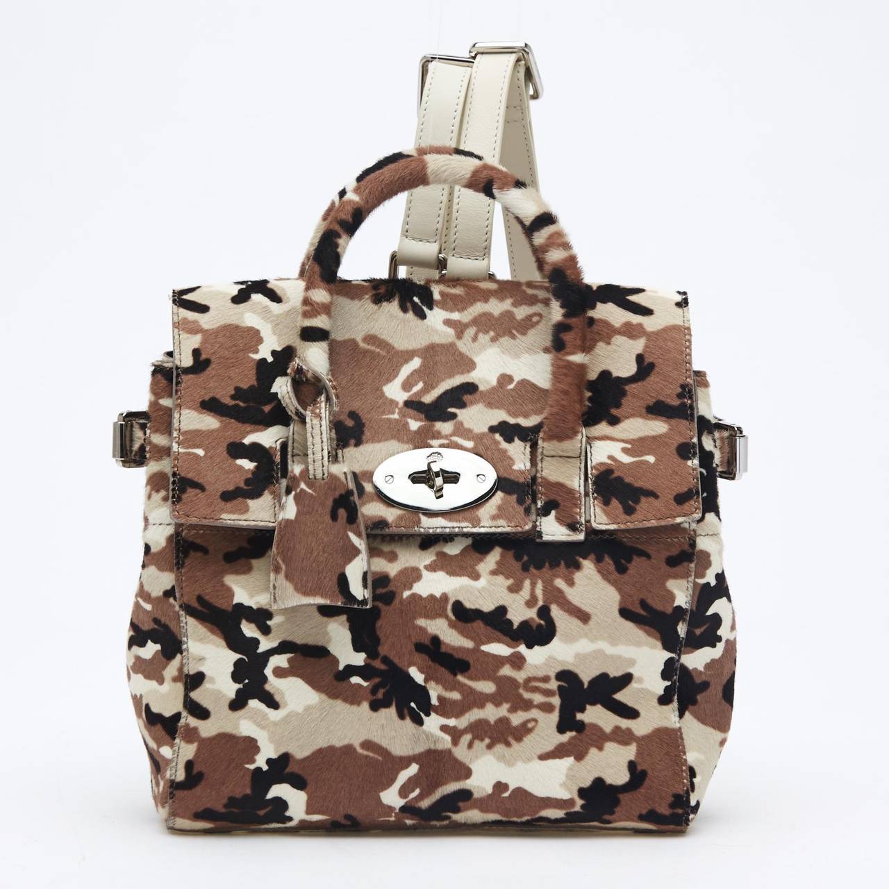 This striking Mulberry Cara Calf Hair Mini is as stylish as Ms. Delevingne herself. This practical-yet-eccentric bag is quite versatile. It can be worn with its removable backpack straps, on the shoulder, or by its handle. The camouflage print makes