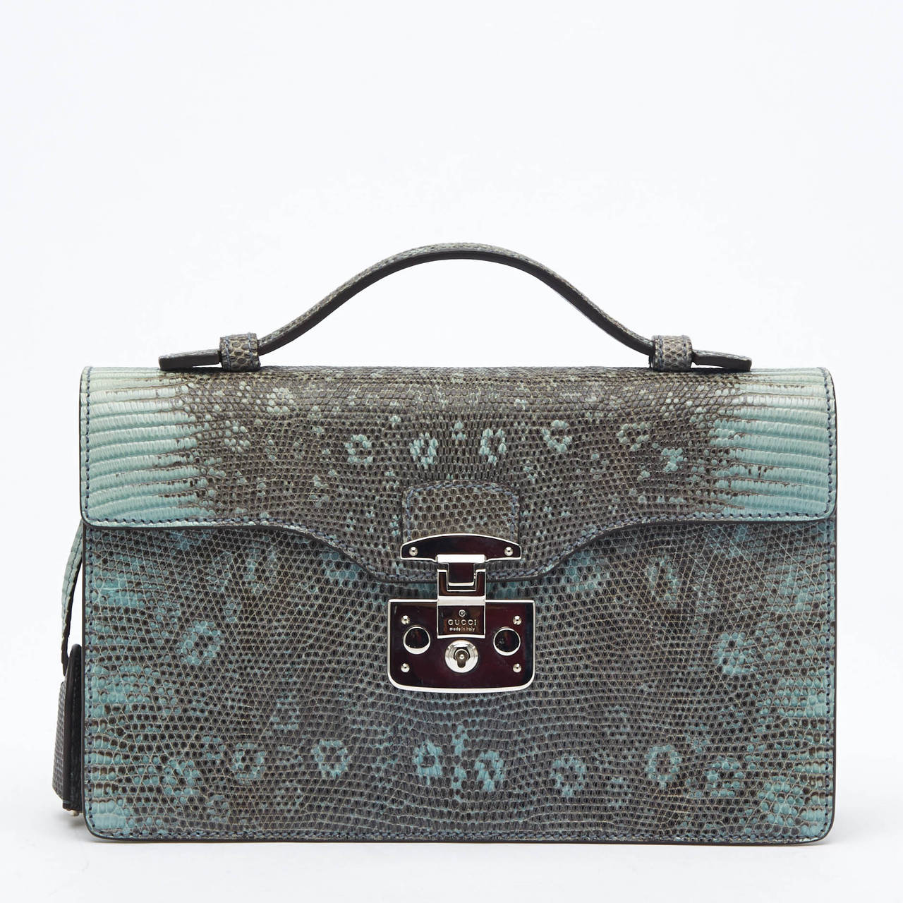 This petite Gucci Lady Lock Briefcase Clutch in Python is beautiful, and the perfect small accessory for the most stylish business person or a night out. This briefcase is featured in pastel green and gray with a contrasting wine suede interior, and