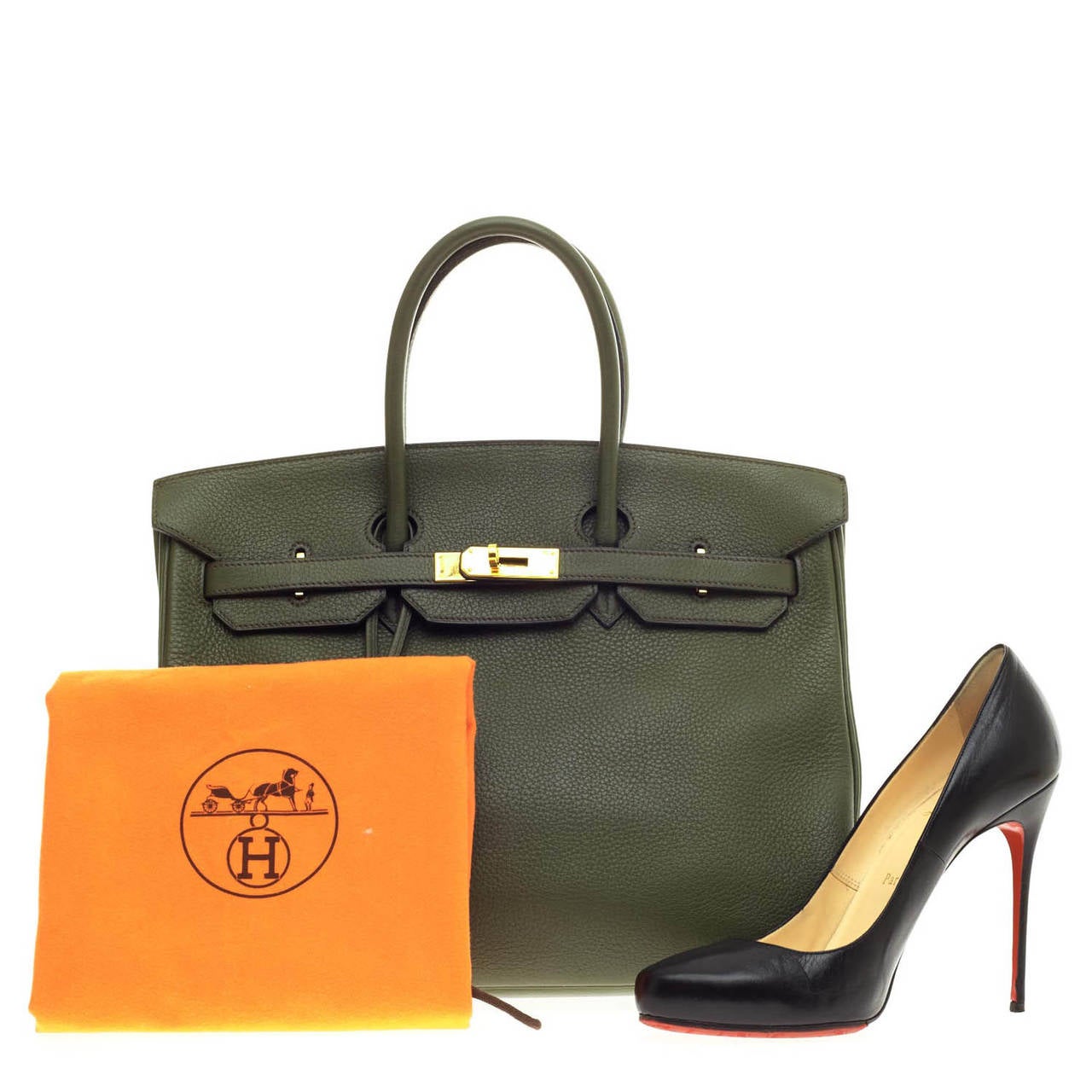 This beautiful authentic Hermes Birkin in size 35 in  is constructed with soft, scratch-resistant Togo Leather and accented with polished Gold hardware. Revered as the most desired handbag, this Birkin's rich olive green color is modest yet