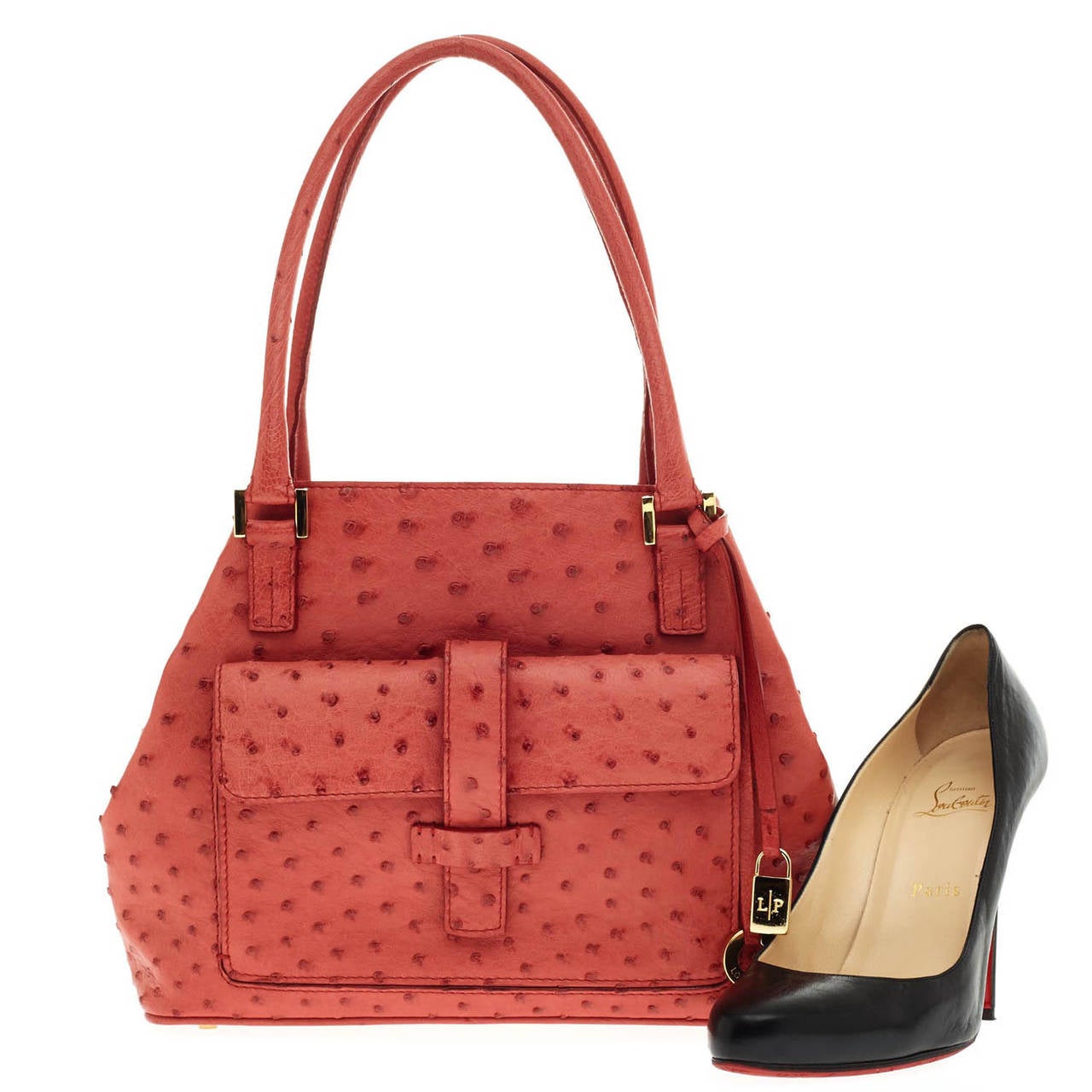 Synonymous with impeccable luxurious Italian quality, this authentic Loro Piana Globe Tote in size Mini in red strawberry color is crafted of fine Ostrich leather and accented with gold-tone hardware. This beautiful bag features multiple pockets on