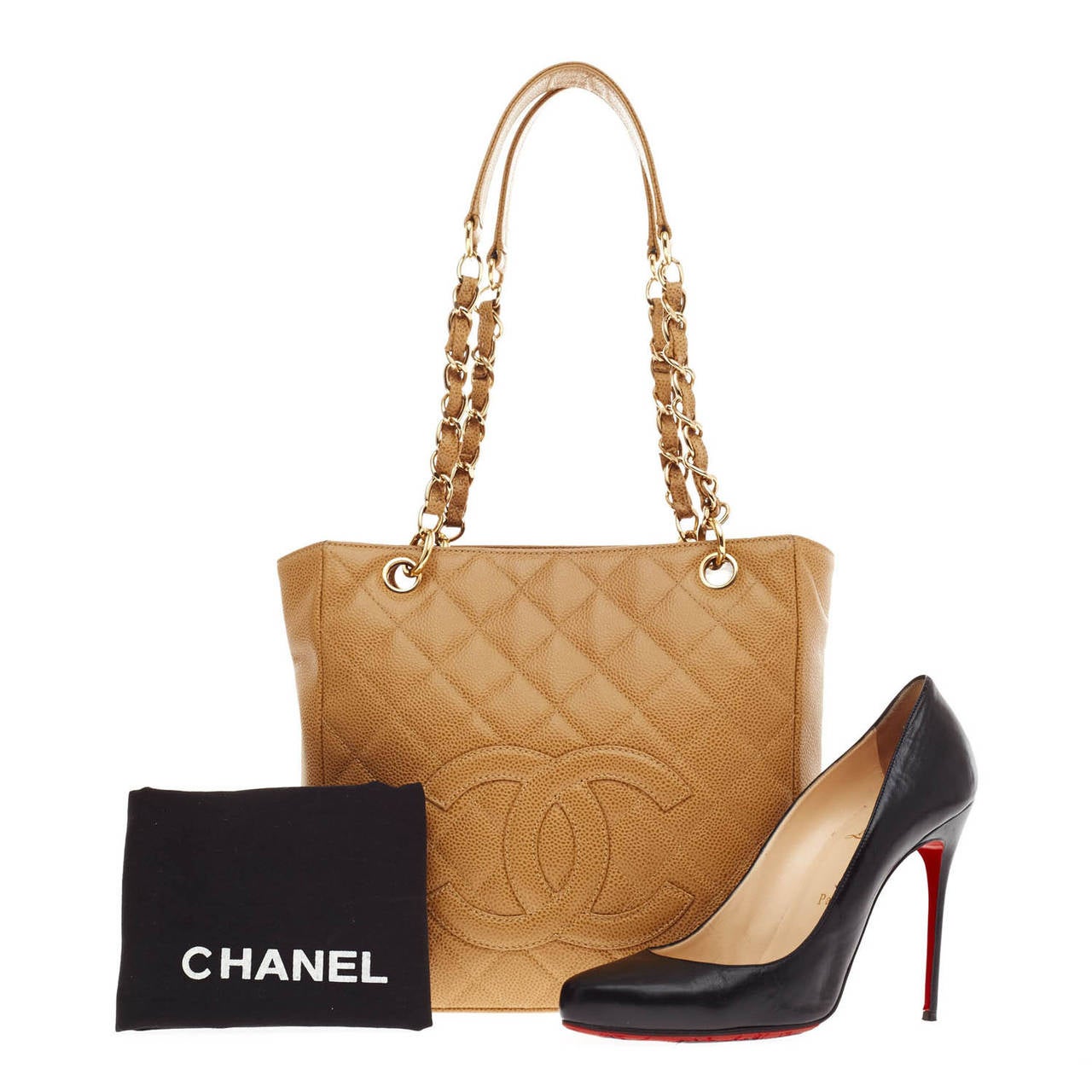 This authentic beautiful Chanel Petite Shopping Tote Caviar is the perfect bag that compliments any outfit in any season. This tan tote is accented with gold-tone hardware and has CC stitched in quilted caviar leather. The bag features dual quilted