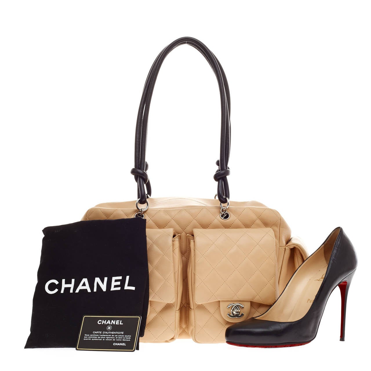 This authentic Chanel Cambon Multipocket Reporter Quilted Calfskin size Medium in Tan is a practical bag with a chic and stylish appeal. Constructed with diamond quilted calfskin leather, this bag features facing and side pocket compartments