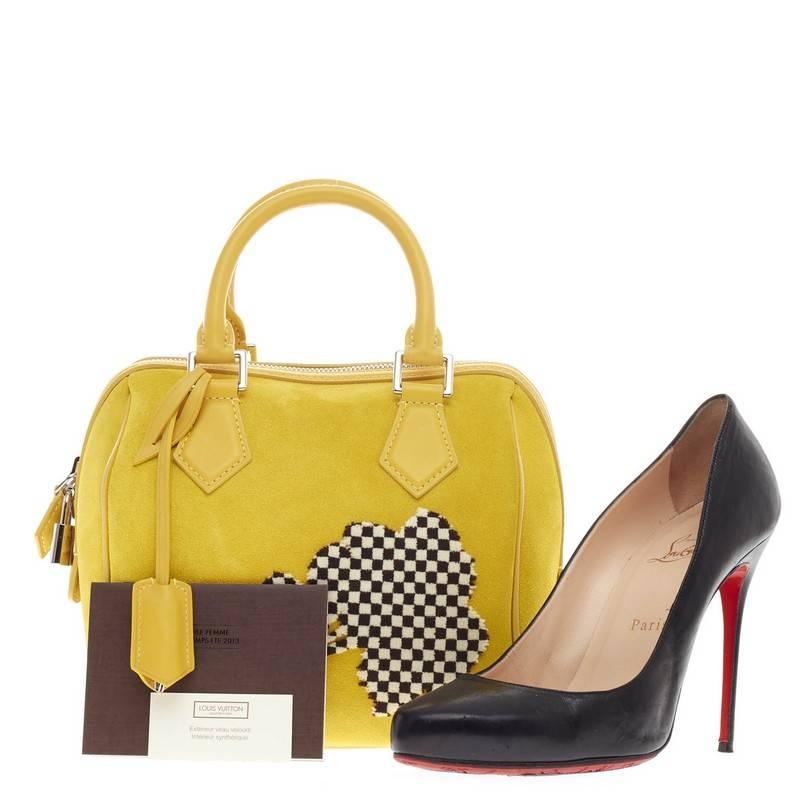 This authentic Louis Vuitton Speedy Cube Illusion Fleur PM released in the brand's Spring 2013 collection showcases the brand's classic speedy cube design with a fun twist. Crafted in bright yellow soft suede and smooth leather with a tuffetage