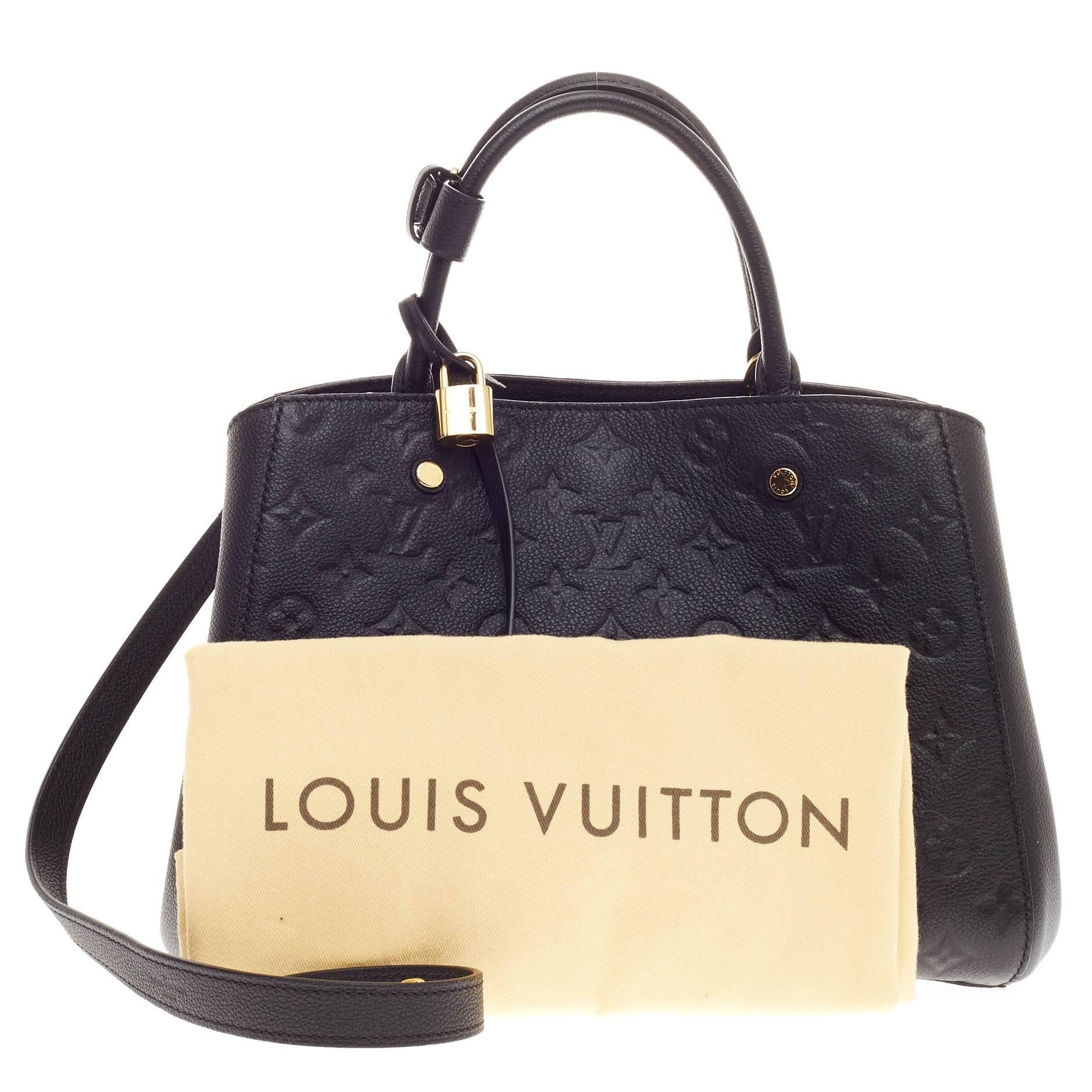 This authentic Louis Vuitton Montaigne Monogram Empreinte Leather MM named after the famed Parisian location is as sophisticated as it is sturdy. Crafted in classic noir black embossed monogram empreinte leather, this luxurious and refined bag