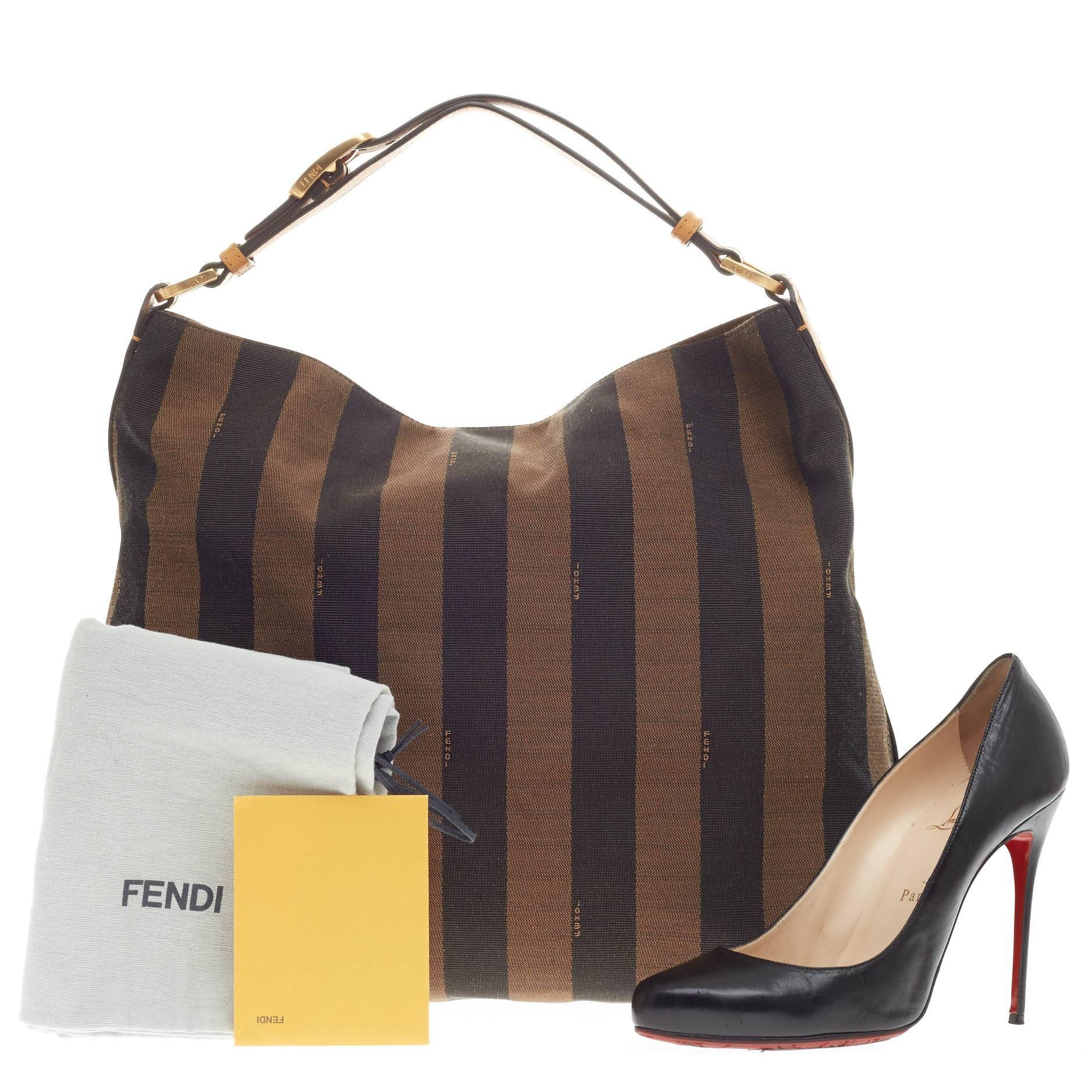 This authentic Fendi Pequin Hobo Canvas is a signature and iconic hobo made for everyday excursions. Crafted in Fendi's iconic pequin striped fabric, this subtly elegant hobo features a looped adjustable leather shoulder strap in stand-out contrast
