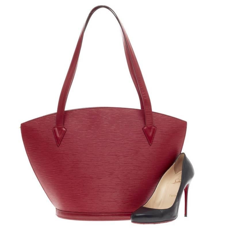 This authentic Louis Vuitton Saint Jacques Epi Leather GM is refined and elegant. Crafted from Louis Vuitton's signature vivid rouge red epi leather and sturdy base, this fan-shaped slim shoulder bag features long straps, subtle LV logo at the front