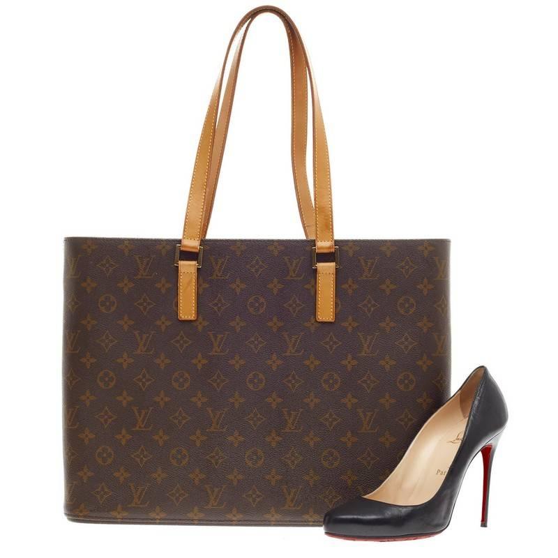 This authentic Louis Vuitton Luco Tote Monogram Canvas is a classic tote design crafted with the brand's iconic LV monogram leather print. The sturdy base allows the bag to stand freely and the multiple interior pockets is designed for easy