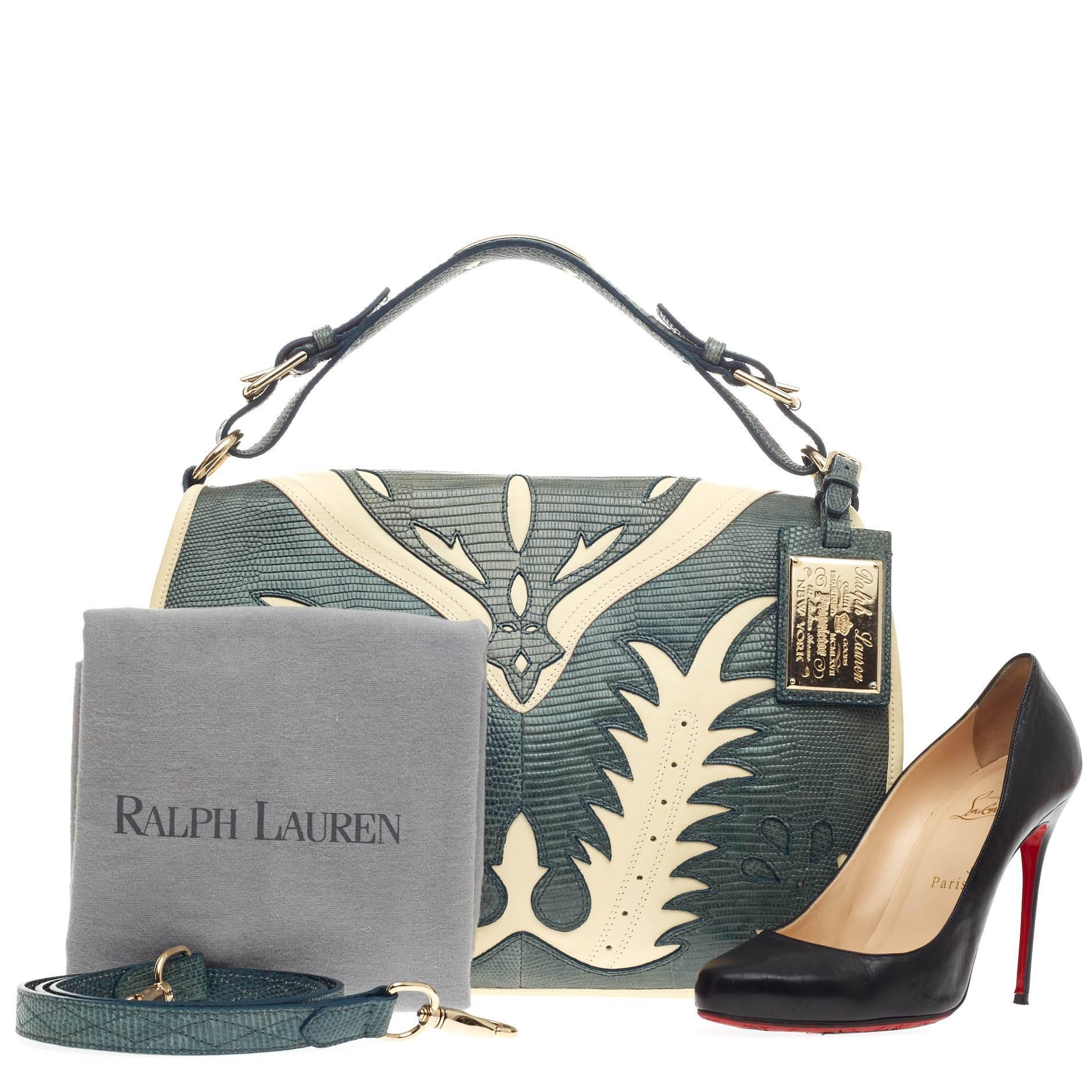This authentic Ralph Lauren Cowboy Saddle Bag Lizard is a limited edition, rare piece mixing luxurious design with a western-inspired flair. Hand-crafted in genuine green lizard skin, this saddle-style hobo features a white cowboy inlay leather