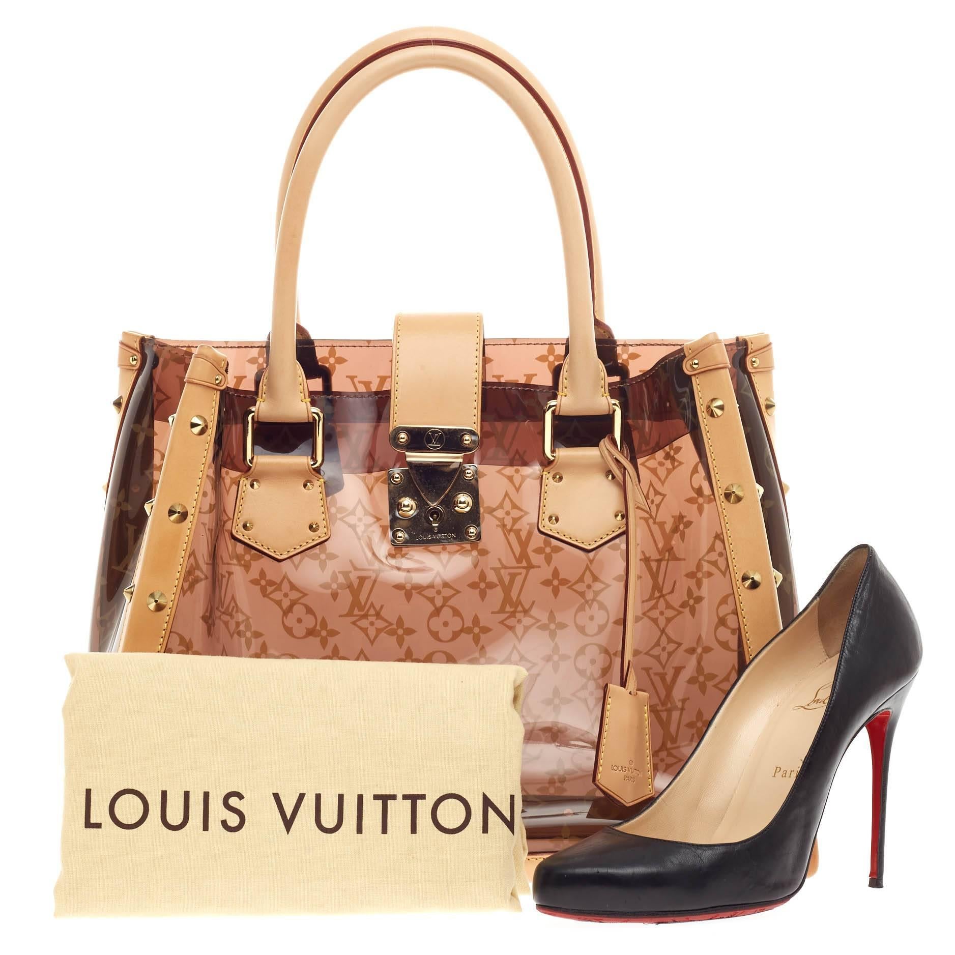 This authentic Louis Vuitton Ambre Neo Cabas Monogram Vinyl showcases a playful design perfect for casual days. Constructed from monogram ambre vinyl and accented with cowhide leather trims, this stylish tote features dual vachetta leather handles,