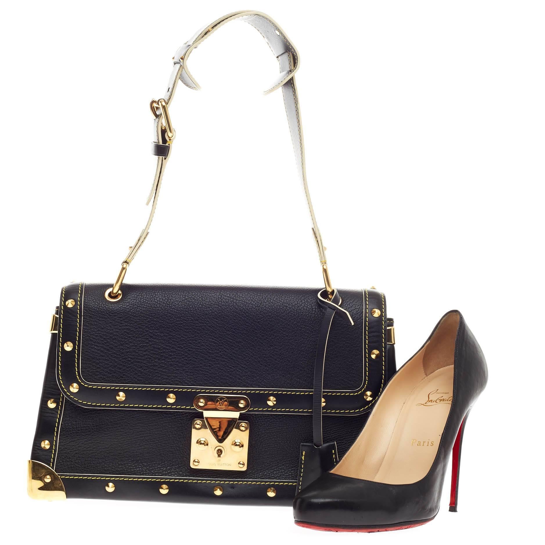 Diese authentische Louis Vuitton Suhali Le Talentueux Leather strahlt einen kantig-schicken Stil aus:: der perfekt für den Alltag ist. Diese elegante Tasche aus glattem schwarzem Ziegenleder verfügt über einen verstellbaren Schulterriemen:: vier