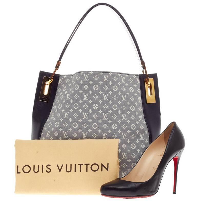 This authentic Louis Vuitton Rendez Vous Monogram Idylle PM is classic and sophisticated ideal for everyday use. Crafted in idylle monogram canvas in encre blue previously known as Mini Lin, this simple yet stylish tote features dark blue leather