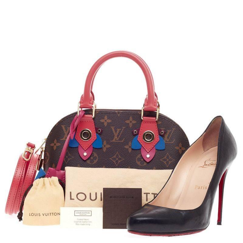 This authentic Louis Vuitton Alma Limited Edition Totem Monogram Canvas BB presented in the brand's Fall/Winter 2015 Collection updates its classic Alma with playful styling and inspired by Gaston Vuitton's african tribal masks. Crafted in iconic