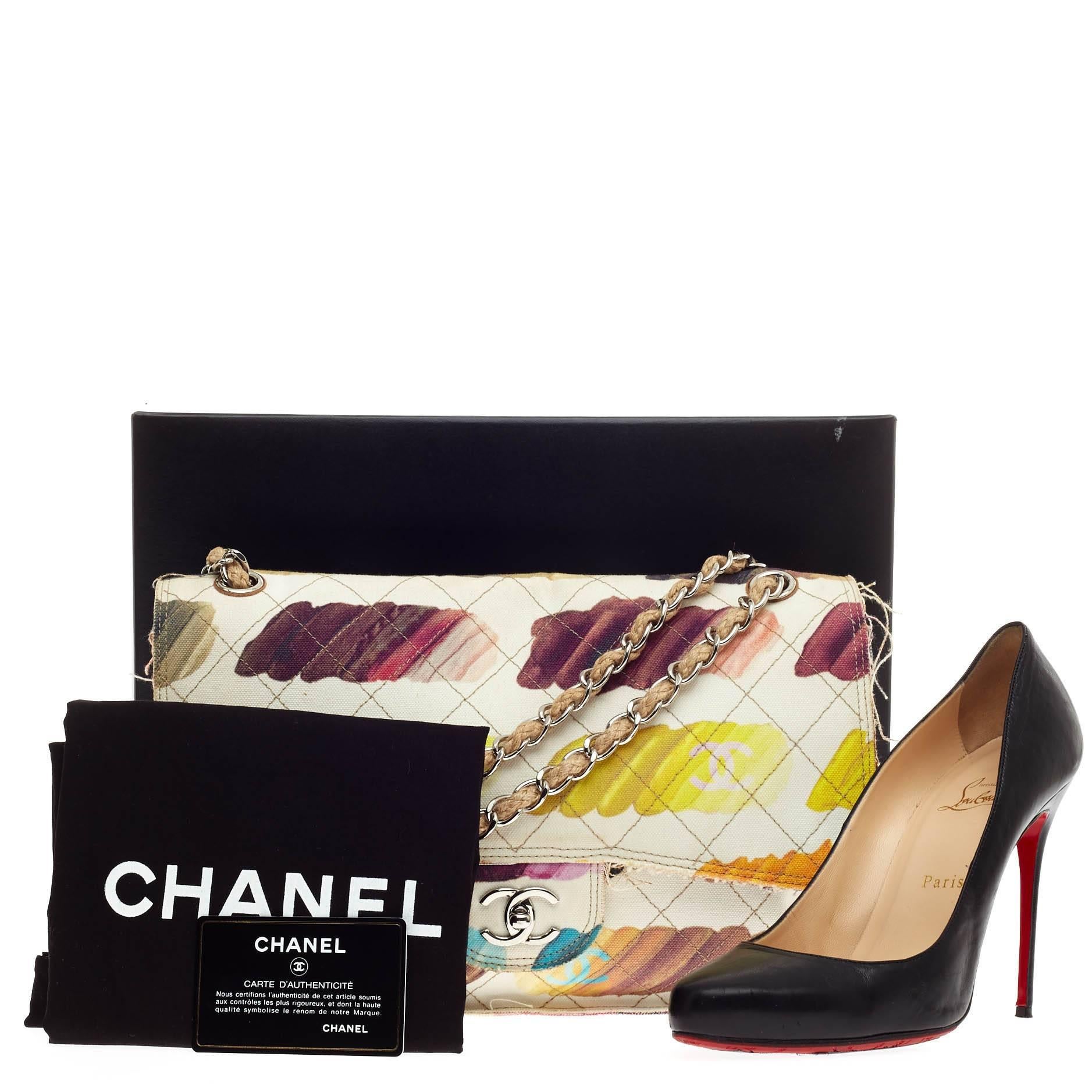 This authentic Chanel Colorama Flap Watercolor Canvas Jumbo, featured in Chanel's Spring/Summer 2014 Act 2 runway collection, mixes traditional styling with avant-garde artistic flair. This modern, fresh flap bag features hand-painted colorful,