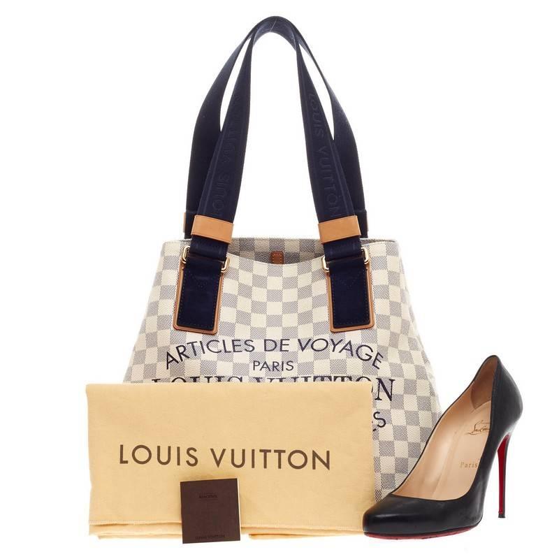 This authentic Louis Vuitton Limited Edition Articles de Voyage Beach Cabas Damier PM released in the brand's 2012 Collection is perfect for summer getaways and light travels. Crafted in beautiful damier azur canvas with voyage lettering, this tote