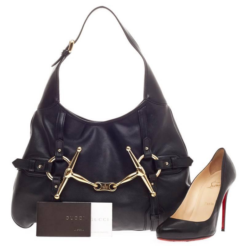 This authentic Gucci Limited Edition 85th Anniversary Hobo Leather is an elegant, everyday hobo that adds a touch of luxury to any look. Finely crafted in smooth black leather, this classically-designed hobo features Gucci's signature gold horse-bit