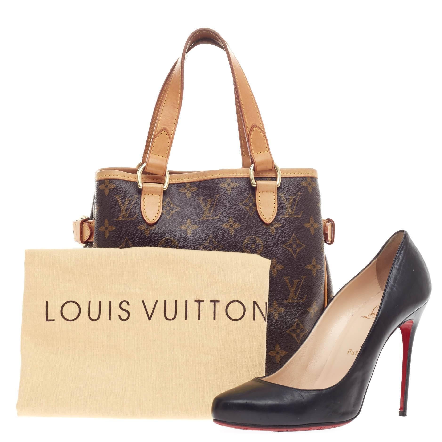 This authentic Louis Vuitton Batignolles Monogram Canvas is a chic and iconic accessory for any fashionista's wardrobe. Crafted from Louis Vuitton's signature monogram canvas print, this bag features cowhide leather trimming and handles, brass