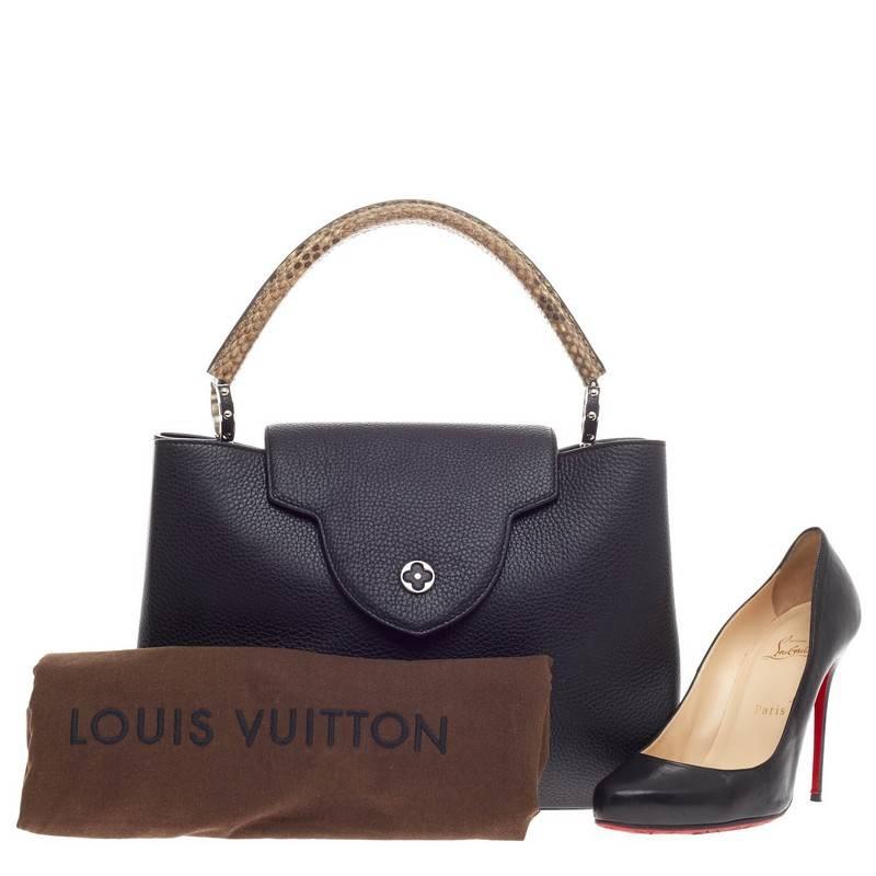 This authentic Louis Vuitton Capucines Leather and Python MM is sophisticated and ladylike luxurious bag from the brand's Fall/Winter 2014 Collection inspired by its Parisian heritage. Crafted in black leather, this chic, stand-out bag features a