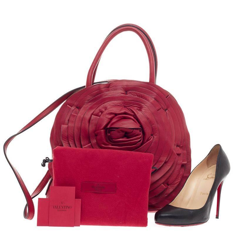 This authentic Valentino Petale Dome Bag Leather is a romantic and feminine, eye-catching piece that can glam up your everyday wardrobe. Crafted in luxurious vivid red nappa calfskin leather, this dome tote features layers of red leather creating a