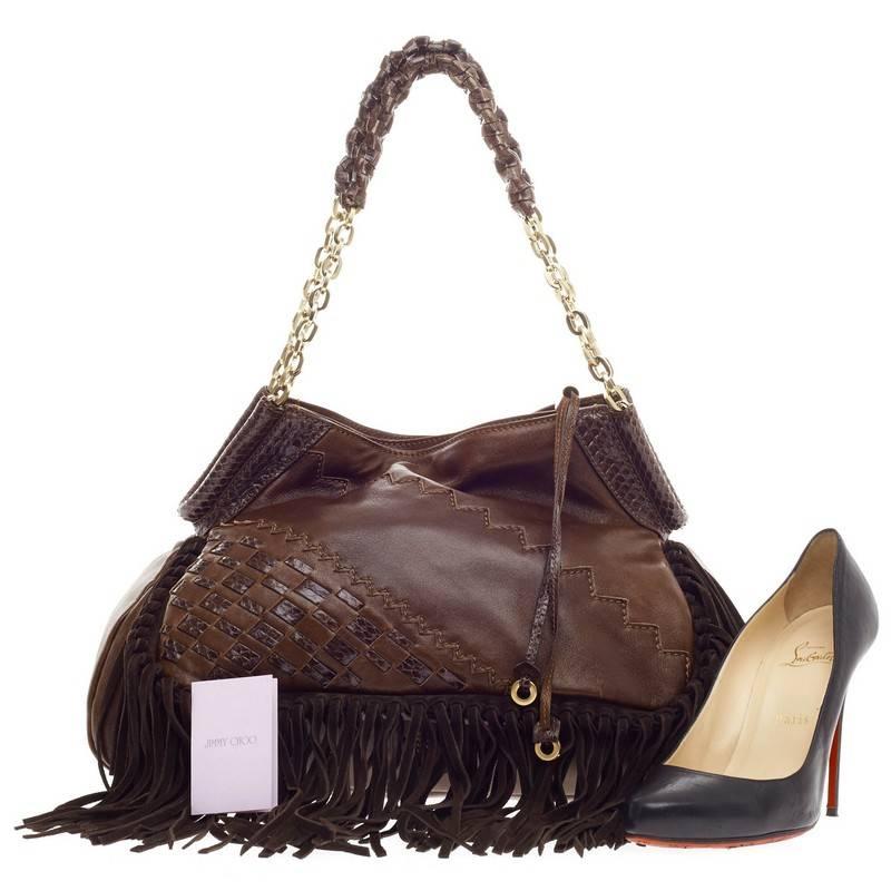 This authentic Jimmy Choo Tatum Fringe Shoulder Bag Leather Large mixes chic, bohemian styling with a luxurious flair. Crafted in brown with natural python trims, this hobo features long, swingy fringes, woven python and suede details, dual chain