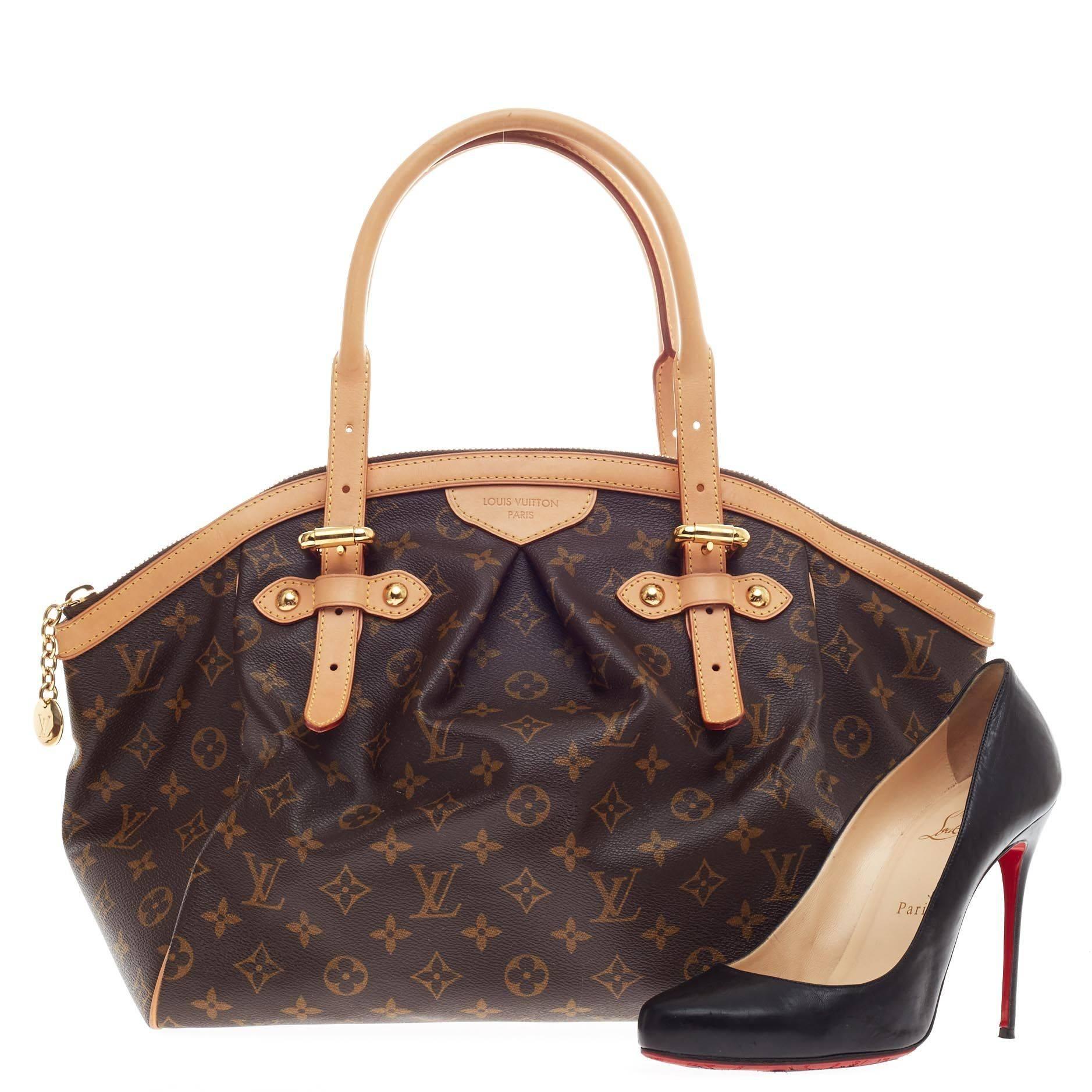 This authentic Louis Vuitton Tivoli Monogram Canvas GM inspired by the Italian city itself combines chic and feminine luxury for everyday use. Crafted from iconic monogram canvas print, this bag features inverted pleating at the front, dual-rolled