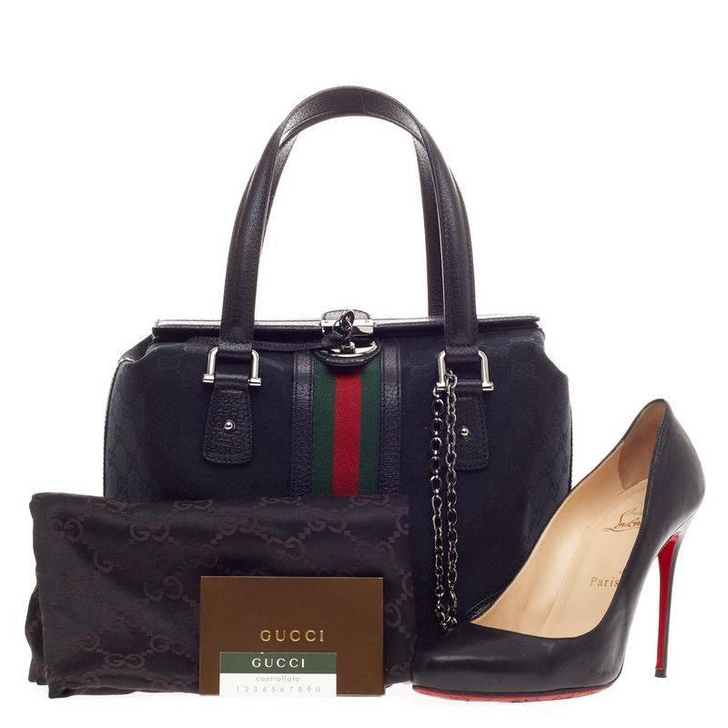 This authentic Gucci Treasure Boston GG Canvas Small is a must-have for Gucci lovers. Constructed from black GG canvas, this boxy bag features Gucci’s web strap details in black, red and green canvas, black leather trims and handles, silver link