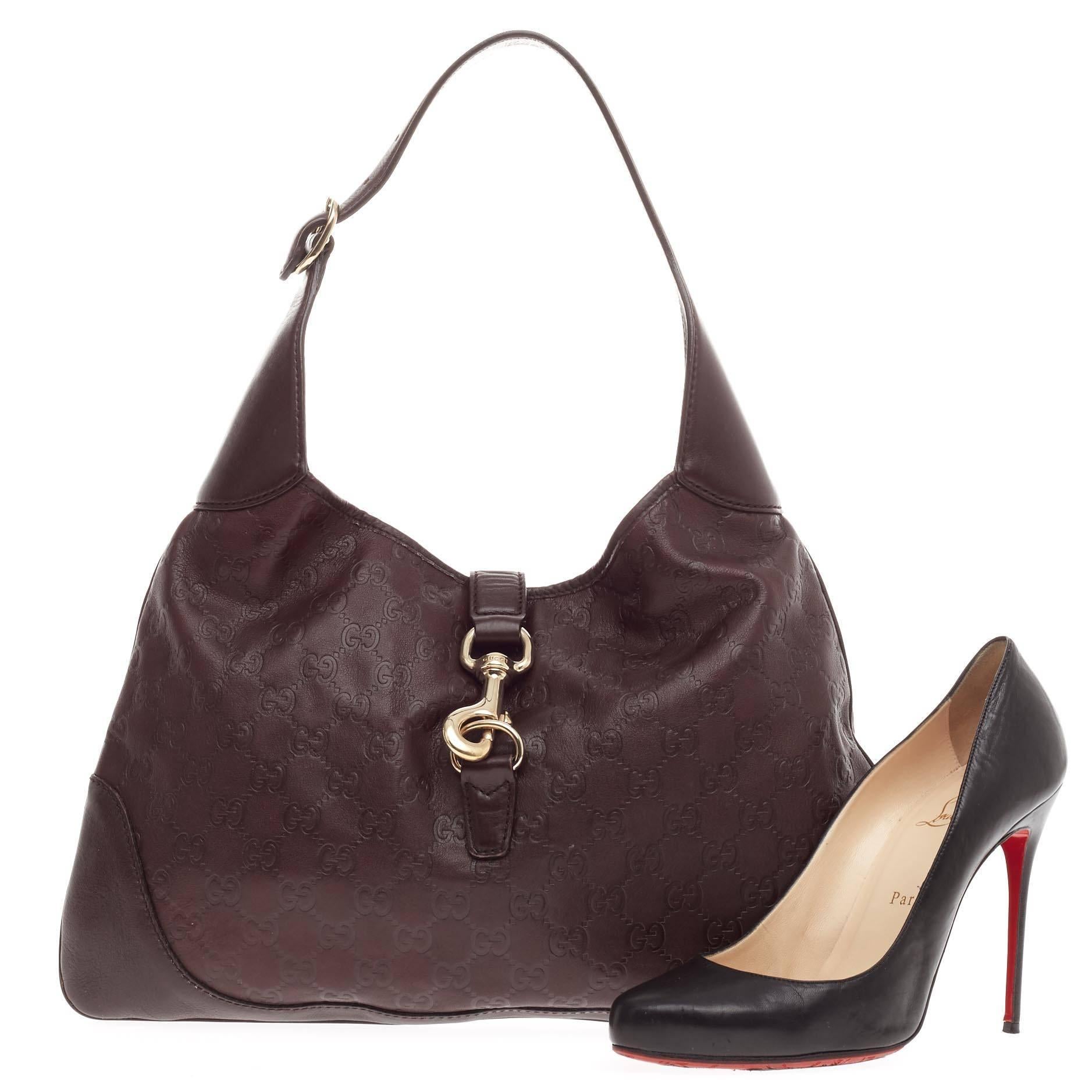 This authentic Gucci Jackie O Guccissima Leather Medium is a must-have luxurious hobo fit for the modern woman. Constructed from dark brown guccissima leather, this iconic hobo features an adjustable shoulder leather strap, and gold-tone hardware