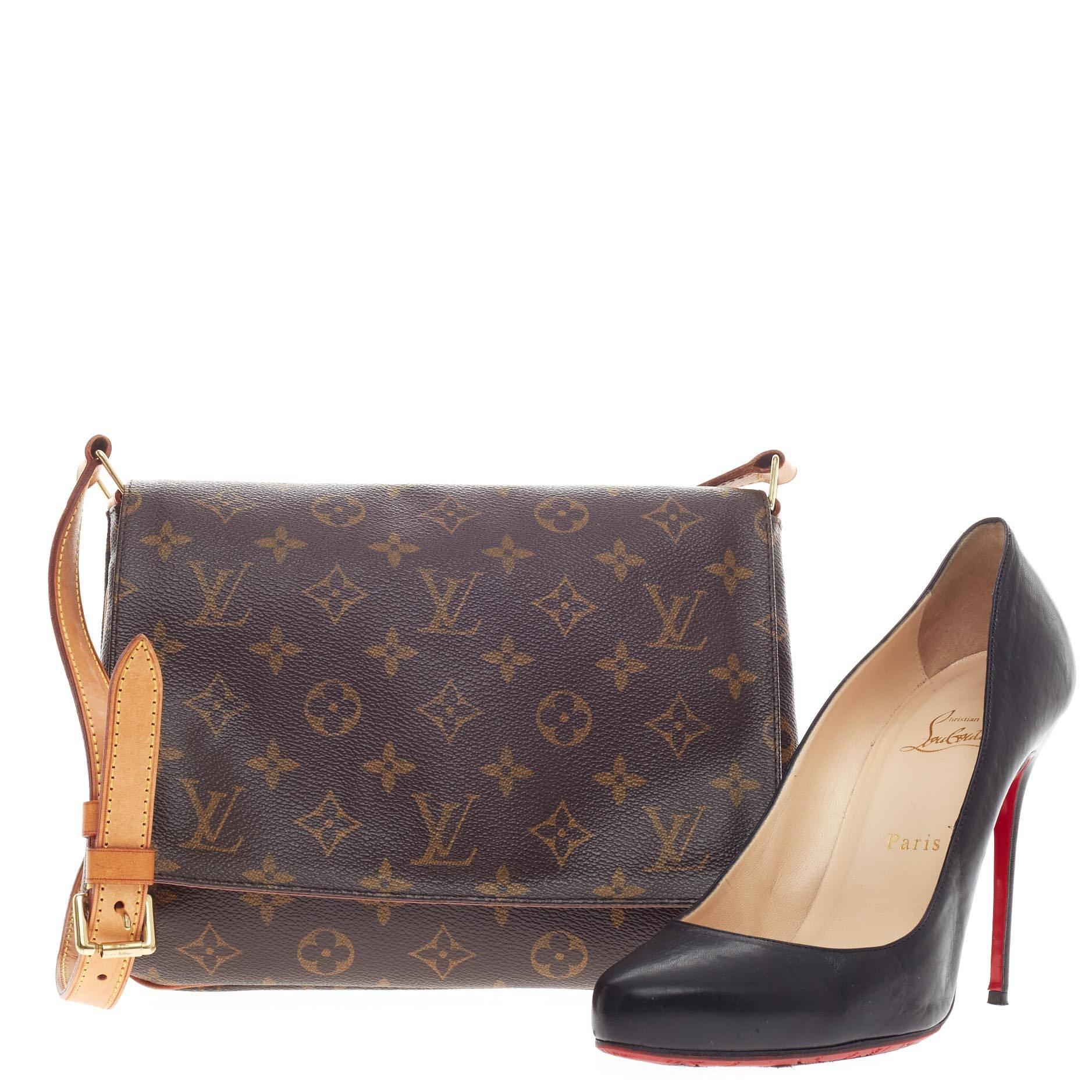 This authentic Louis Vuitton Musette Tango Monogram Canvas features the classic Louis Vuitton brown monogram canvas print on a simple, classic satchel design. This bag features a full flap style, adjustable cowhide leather strap for added