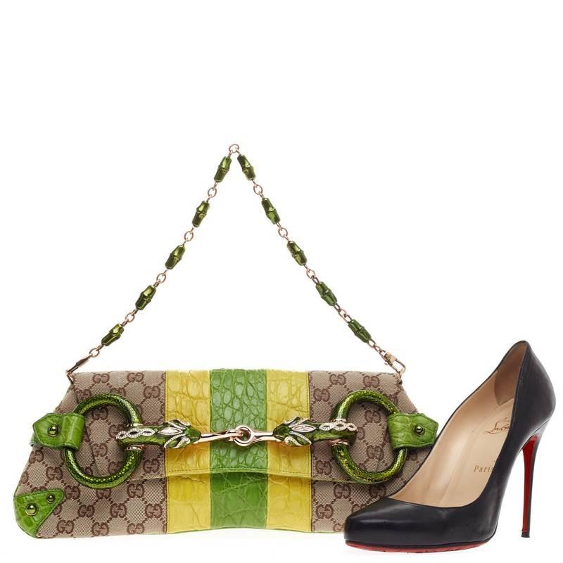This authentic Gucci Horsebit Chain Strap Clutch Python Large created by iconic designer Tom Ford exudes a  funky, edgy twist on a classic design. Crafted from signature GG canvas with genuine neon green and yellow alligator skin detail, this
