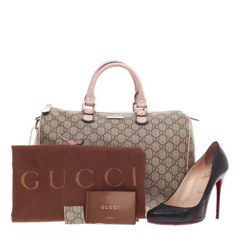 This authentic Gucci Mermaid Joy Boston Bag GG Coated Canvas Medium released in the brand's 2009 Collection is a uniquely designed, exclusive boston bag for everyday use. Crafted from brown GG coated canvas, this bag features a tattooed Gucci