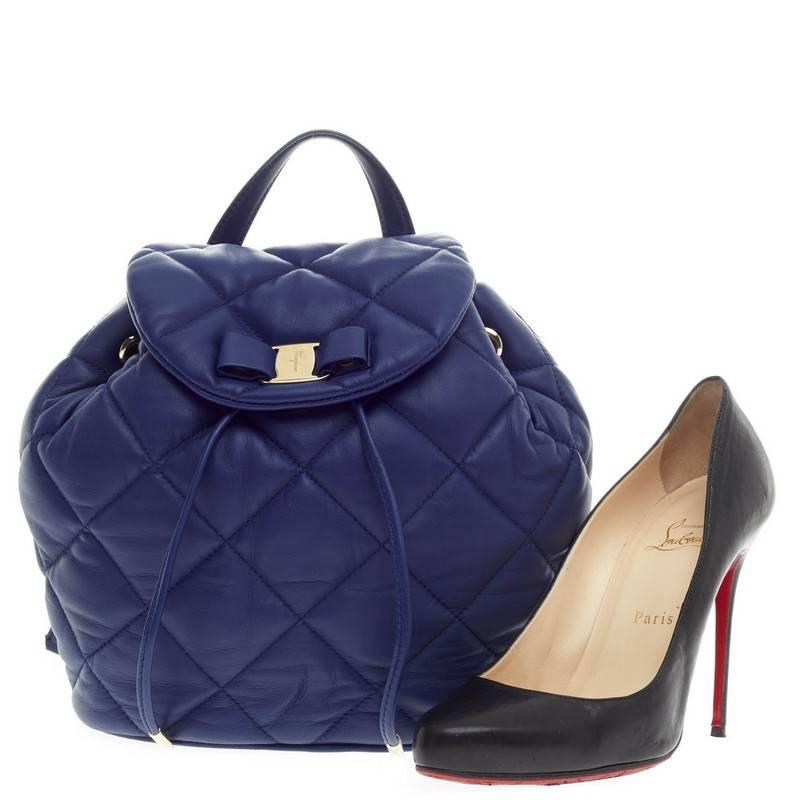 This authentic Salvatore Ferragamo Giuliette Backpack Quilted Leather is a chic and feminine backpack that compliments any casual look. Crafted from puffy royal blue quilted leather, this stand-out, stylish backpack features dual adjustable chain