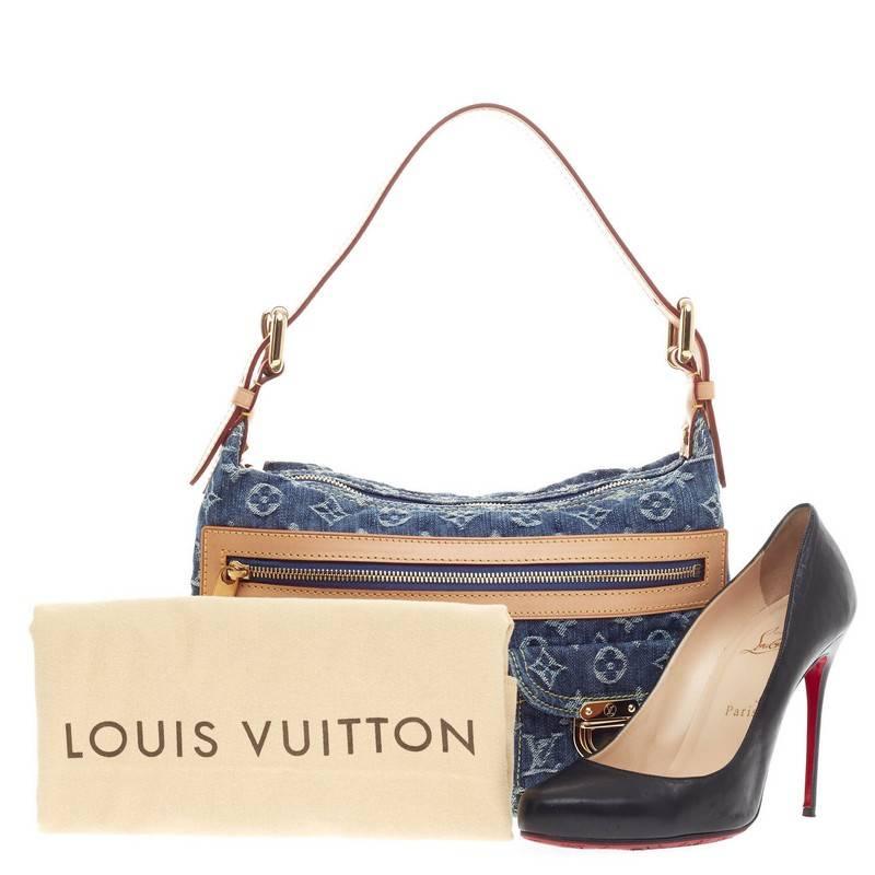 This authentic Louis Vuitton Baggy Denim PM is a fresh twist on an iconic design that will stylishly complement a casual look. Crafted from monogram print in washed denim fabric, this bag features vachetta leather trim, yellow contrast stitching,