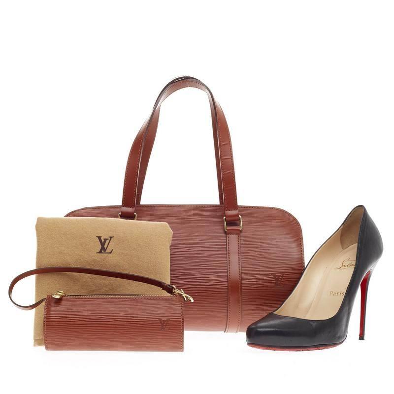 This authentic Louis Vuitton Soufflot Epi Leather is ideal for carrying daily essentials. Crafted with Louis Vuitton's kenya fawn epi leather, this bag features a rounded shape with a wide gold-tone zip closure for easy accessibility, dual straps