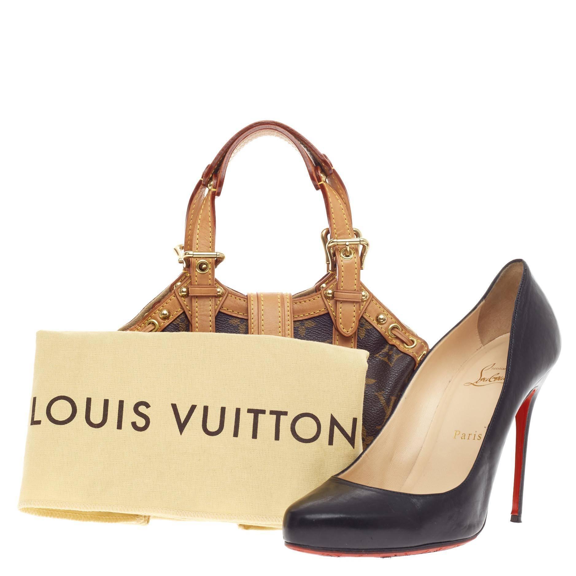 This authentic Louis Vuitton Theda Monogram Canvas PM showcases a balance of feminine style with classic design. Constructed from Louis Vuitton's signature monogram canvas print, this limited edition collection shoulder bag features dual belted