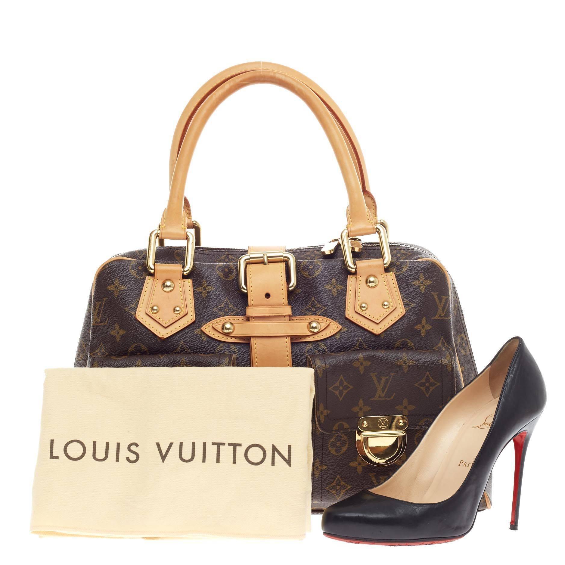 This authentic Louis Vuitton Manhattan Monogram Canvas GM combines style and functionality apt for the modern day woman. Constructed from Louis Vuitton's signature monogram printed canvas, this classic satchel features dual-rolled vachetta leather