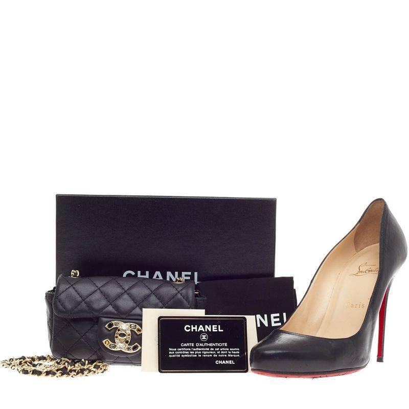 This authentic Chanel Precious Jewel Flap Quilted Lambskin Extra Mini inspired by its classic flap showcases a glamorous, and eye-catching twist made for the modern woman. Crafted in black quilted lambskin, this embellished flap features an iconic