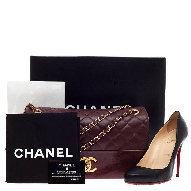 This authentic Chanel Soft Elegance Flap Bag Distressed Calfskin Jumbo presented in the brand's Fall/Winter 2013 Collection mixes classic Chanel styling with a modern twist. Crafted from distressed quilted calfskin in rich burgundy, this chic flap