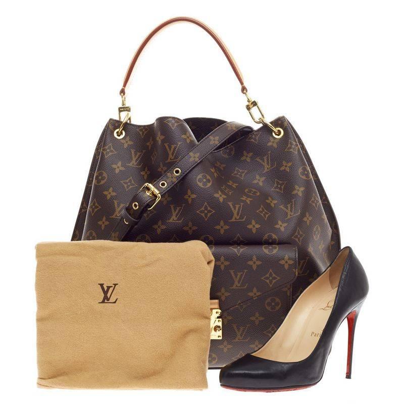 Diese authentische Louis Vuitton Metis Hobo Monogram Canvas verkörpert luxuriöses Design und das Bekenntnis der Marke zu zeitloser Raffinesse mit einem modernen Twist. Diese moderne Hobo aus braunem Canvas mit Monogrammdruck verfügt über eine