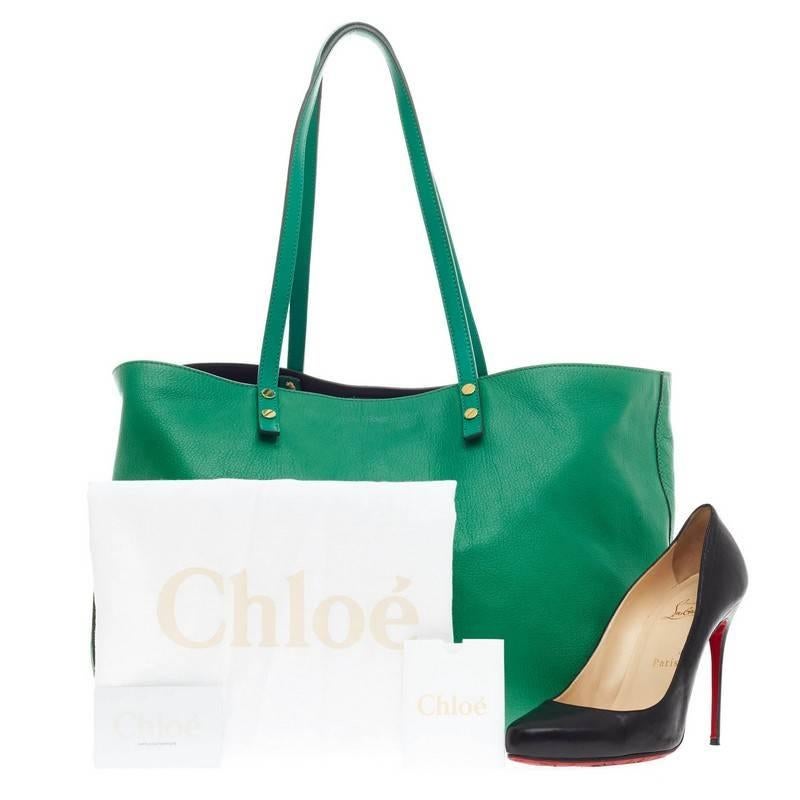 This authentic Chloe Dilan Tote Leather East West is your perfect, casual everyday tote. Crafted from seafoam green, soft textured leather, this simple shopping tote features flat, tall leather handles, subtle stamped Chloe logo at the front,