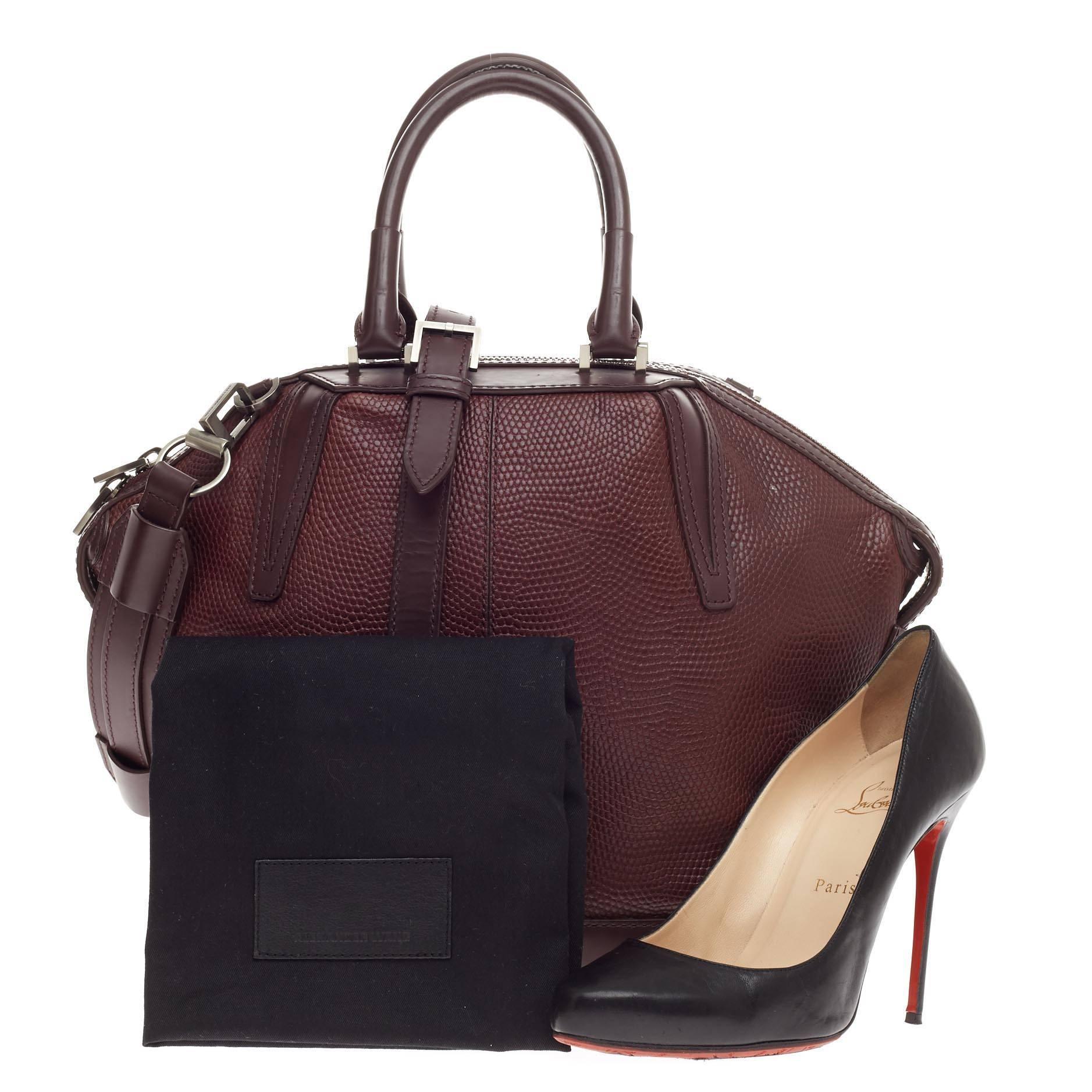 This authentic Alexander Wang Prisma Skeletal Emile Tote Embossed Lizard Large is a stylish easy-to-carry bag for any casual outfit. Crafted from oxblood embossed lizard leather, this angular, tapered bag features four faceted corners and leather