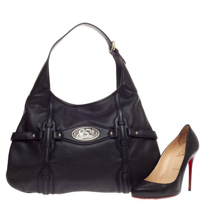 This authentic Gucci Limited Edition 85th Anniversary Hobo Leather is an elegant, everyday hobo that adds a touch of luxury to any look. Finely crafted from smooth black leather, this classically-designed hobo features Gucci's signature horsebit