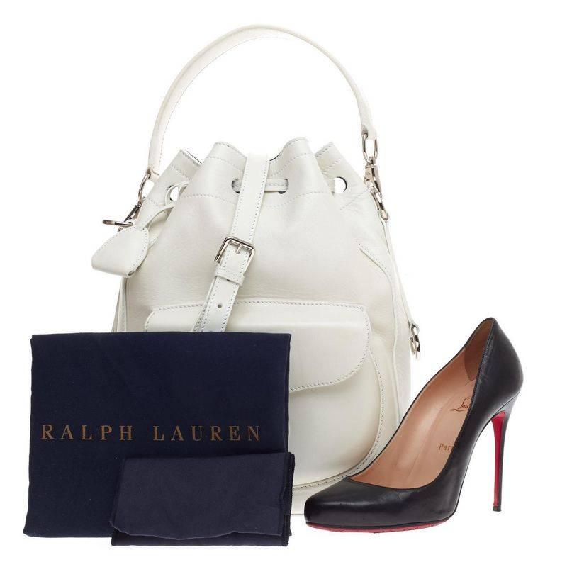 This authentic Ralph Lauren Collection Ricky Drawstring Bag Leather Medium is a reinvention of the brand’s most loved Ricky collection. Crafted from stark white leather, this stylish bucket bag features an exterior front flap pocket with Ricky