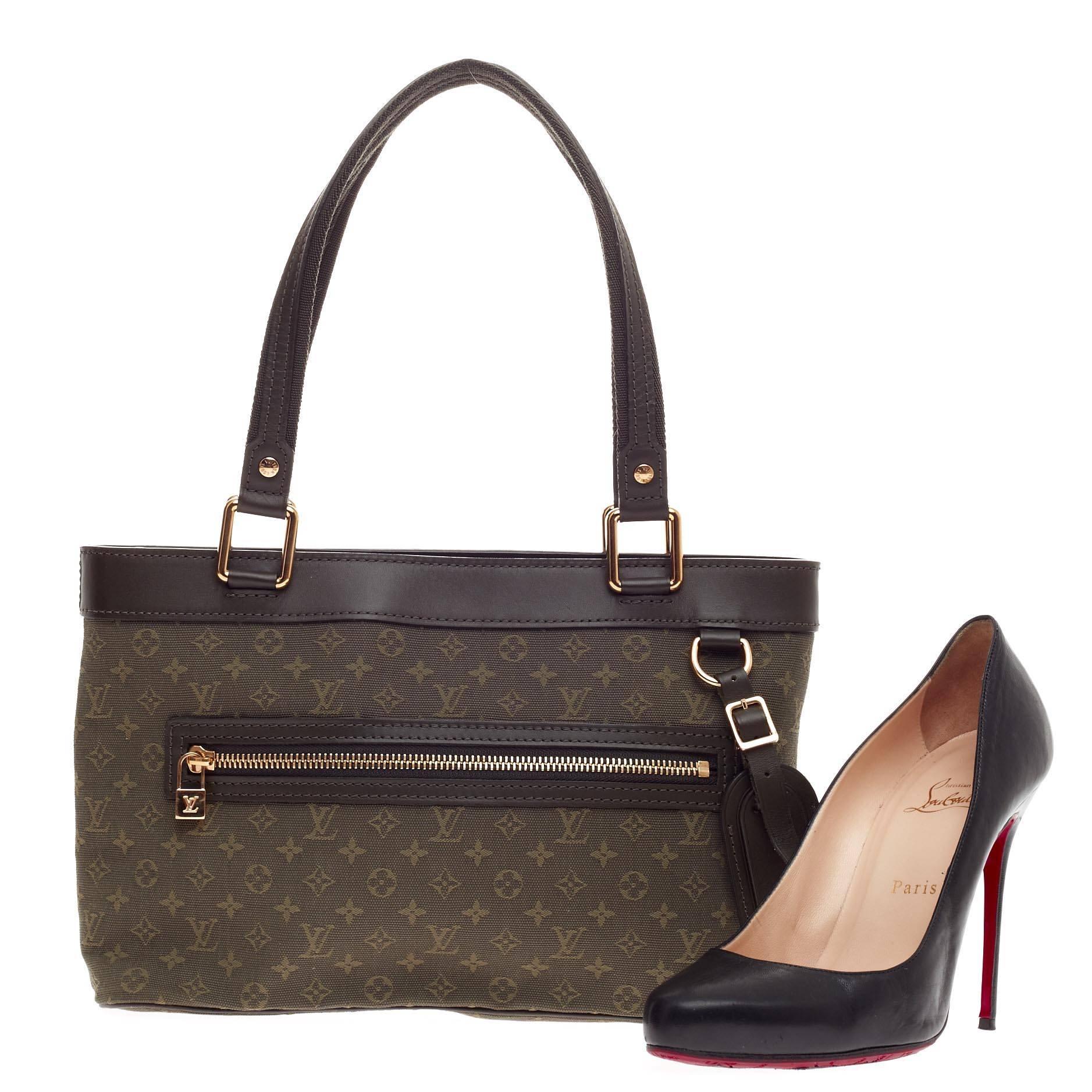 This authentic Louis Vuitton Lucille Mini Lin PM is simple and classic ideal for your everyday casual look. Crafted from khaki green monogram mini lin canvas, this simple tote features green leather trims and handles, dual flat tall handles,