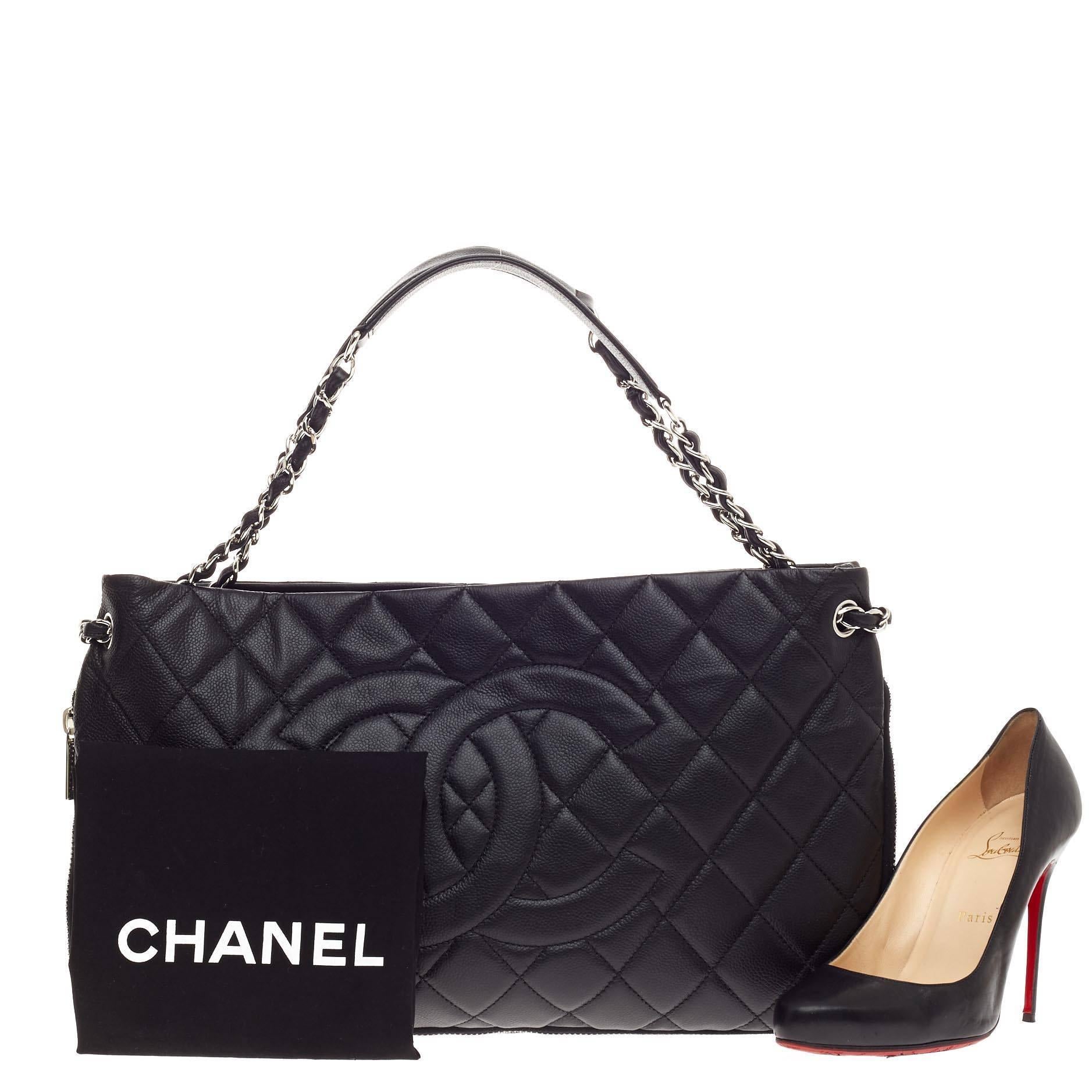 This authentic Chanel Timeless CC Expandable Tote Quilted Caviar Medium mixes modern style and versatility that will compliment a multitude of looks. Crafted from black caviar leather, this unique tote features Chanel's iconic diamond quilting,