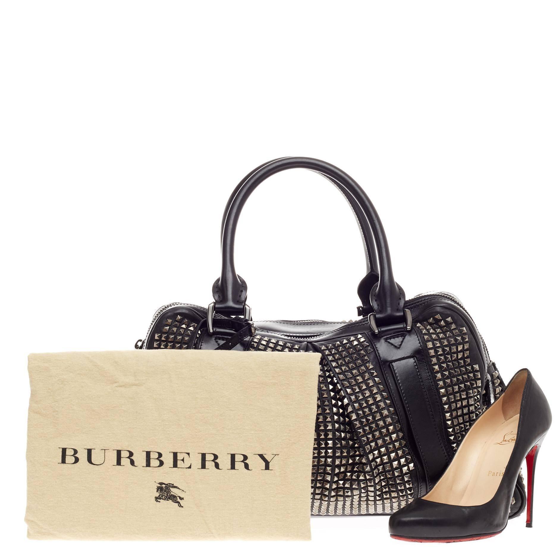 This authentic Burberry Knight Bag Studded Leather from its 2012 Collection is a stunning, sold-out, medieval-inspired piece beloved by many. Crafted in black leather with feminine pleated detailing, this edgy bag features embellished chrome-tone