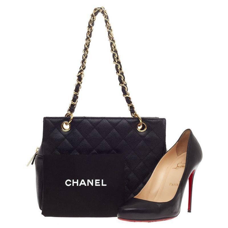 This authentic Chanel Petite Timeless Tote Caviar is a classic design from the luxury brand made for everyday use. Crafted from black caviar leather, this smaller-sized tote features classic Chanel quilted diamond design, stitched Chanel CC logo,