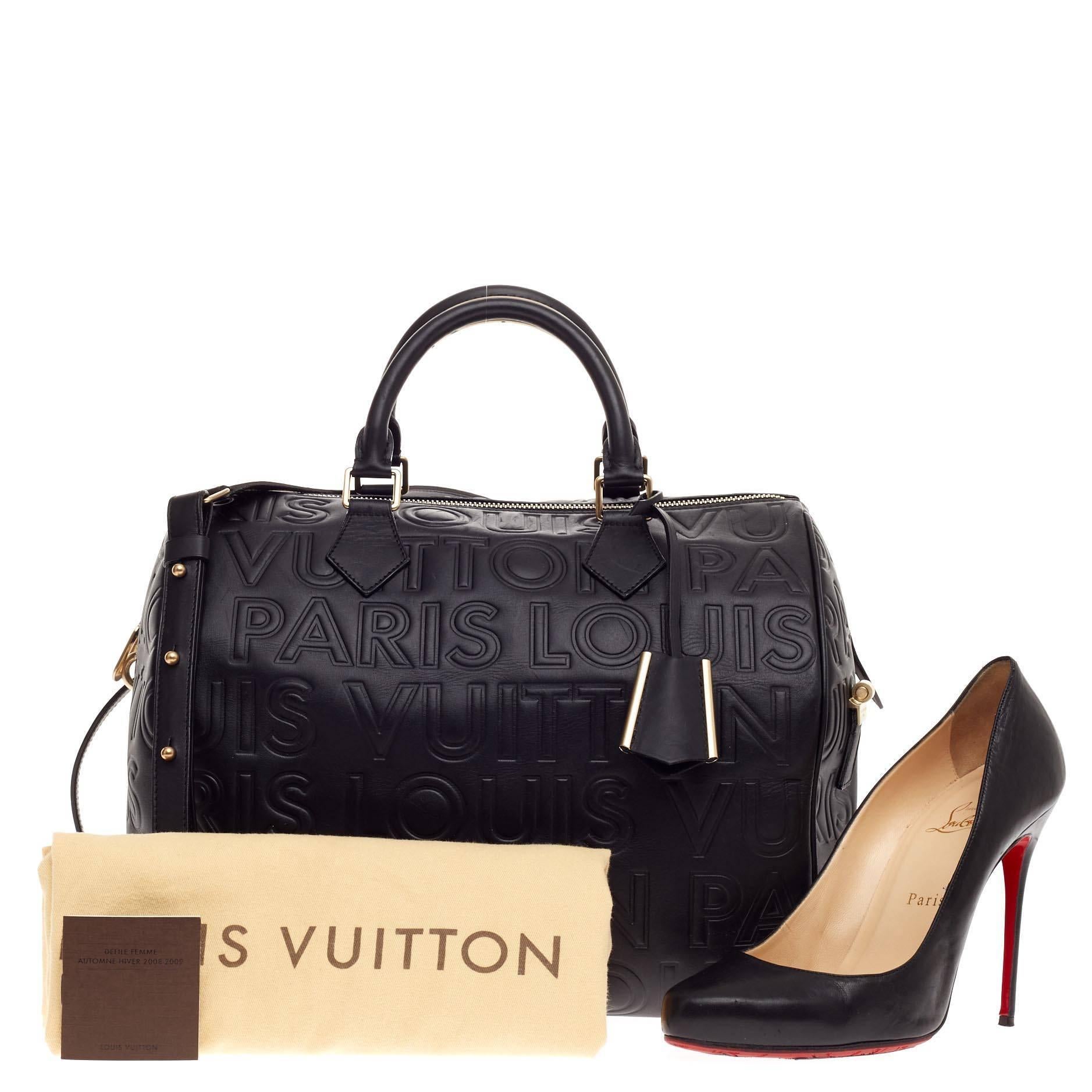 This authentic Louis Vuitton Paris Speedy Cube Embossed Leather 30 presented in the brand's Fall/Winter 2008 Collection updates the classic Speedy with a youthful, edgy style. Crafted from supple black leather, this Speedy features embossed Paris