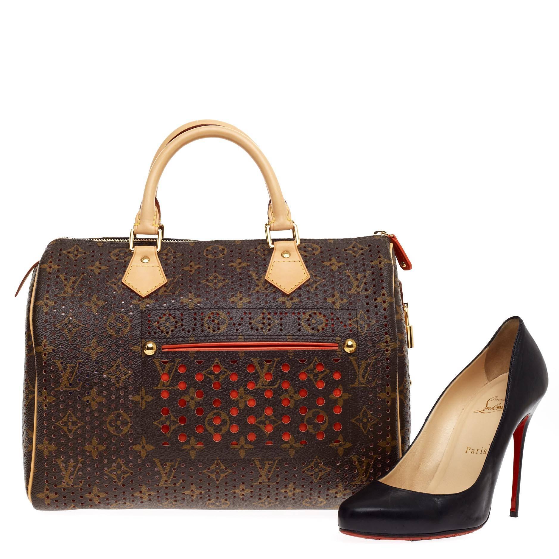 This authentic Louis Vuitton Speedy Perforated Monogram Canvas 30 from the brand's monogram perfo collection is a must-have addition for any Louis Vuitton lover. Constructed from iconic brown perforated monogram printed canvas with stand-out bright