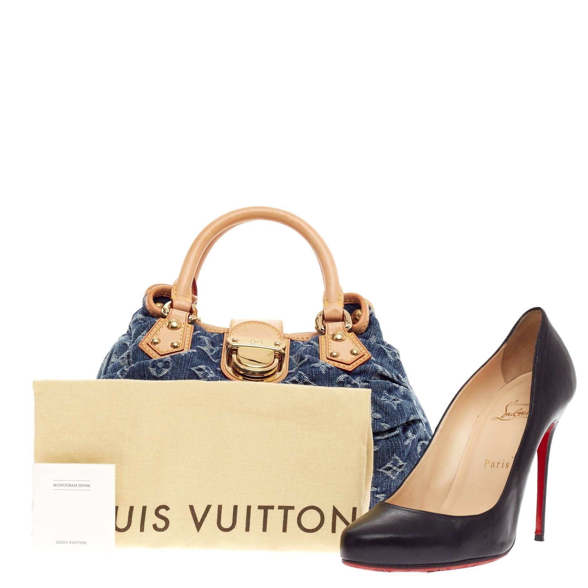 This authentic Louis Vuitton Pleaty Denim Small showcases a fun twist to the classic monogram design. Crafted from stonewashed blue monogram denim, this small hobo features dual-rolled vachetta leather handles, vachetta leather trims with yellow